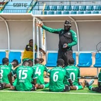 Coach on the pitch